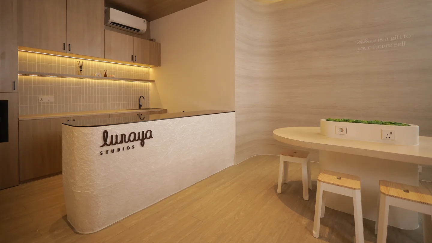 The cafe counter with the Lunaya wordmark and a long tasting table